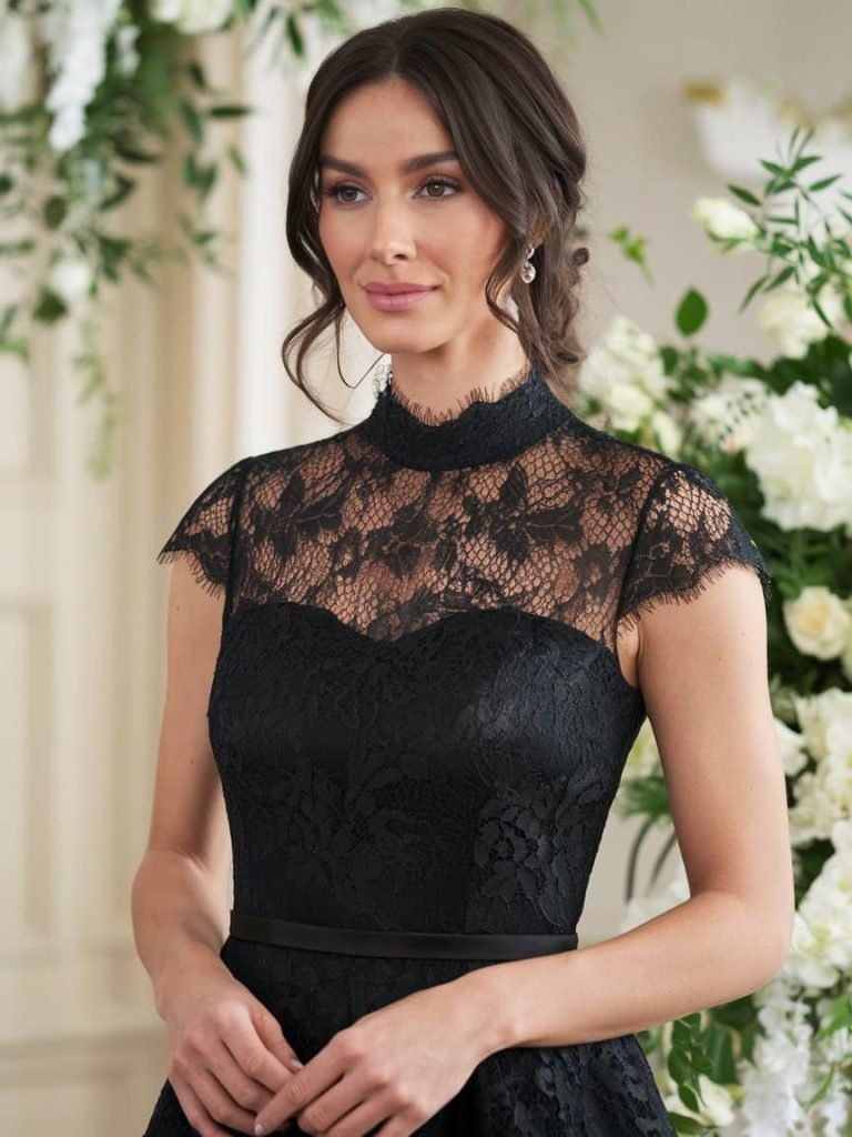 Black Tie Wedding Guest Dress featuring classic lace details and cap-sleeve design.

