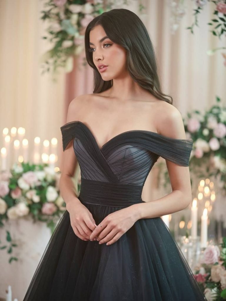 Romantic Black Tie Wedding Guest Dress with an enchanting black off-the-shoulder design.
