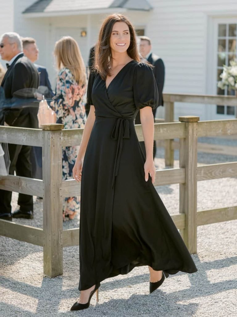 Black Tie Wedding Guest Dress featuring a stylish wrap design, perfect for a graceful evening occasion.
