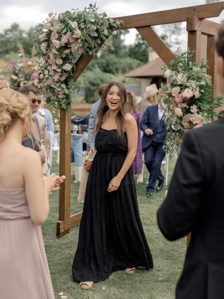 Graceful black maxi gown perfectly captures the essence of Black Tie Wedding Guest Dresses.
