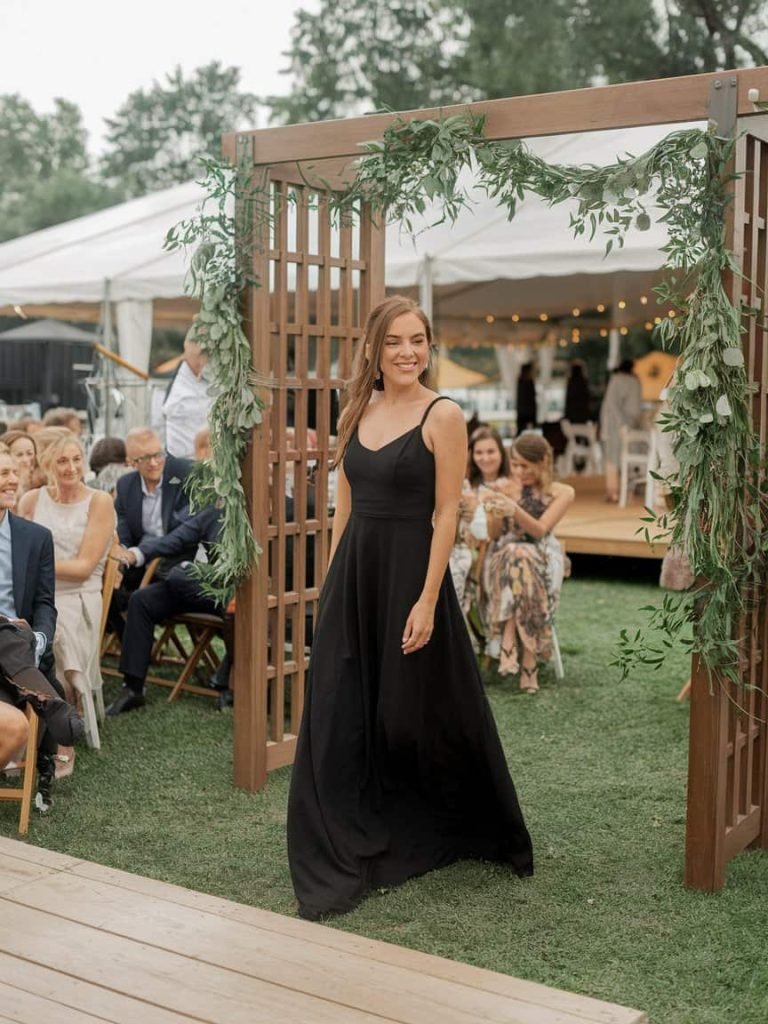 Black Tie Wedding Guest Dress with flowing black maxi design, adding charm to any wedding event.
