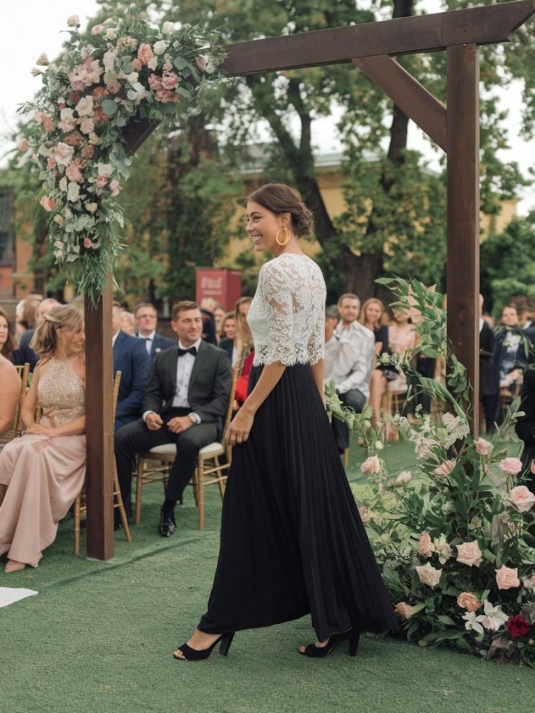 Black Tie Wedding Guest Dress with flowing black maxi design, adding charm to any wedding event.

