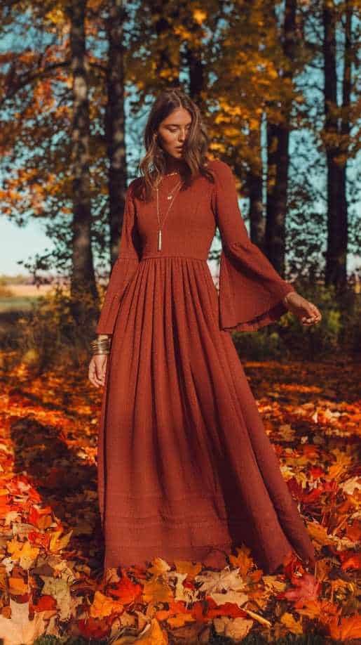 Elegant rust-colored maxi dress with bell sleeves, perfect for fall wedding guest dresses