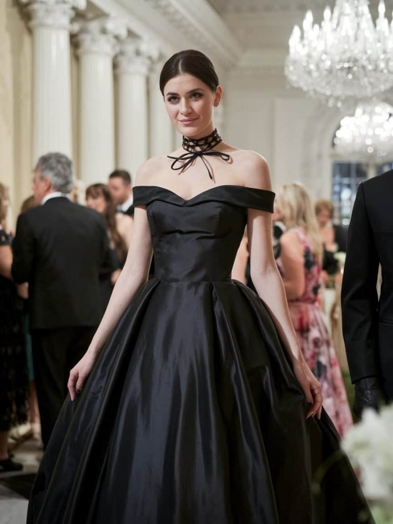Elegant woman in a timeless black ball gown showcasing Black Tie Wedding Guest Dresses style at a chic wedding.