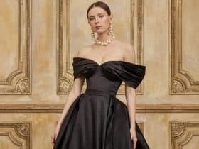 Elegant black tie wedding guest dress featuring a floor-length silhouette and intricate beading