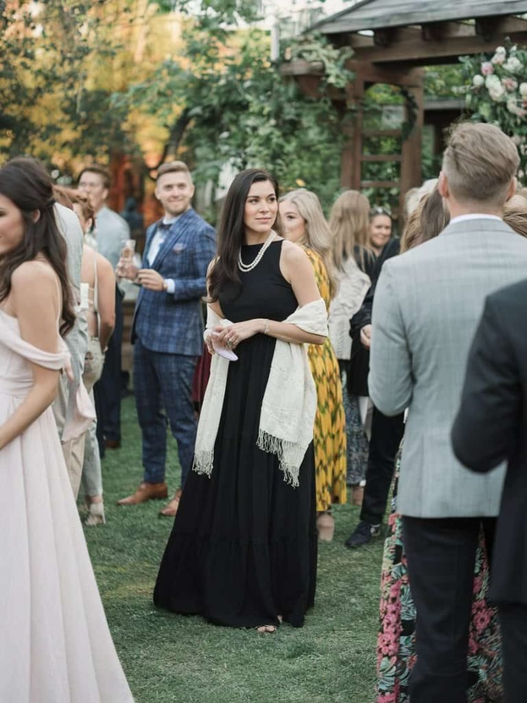 Elegant black maxi dress highlights the versatility of Black Tie Wedding Guest Dresses at a formal occasion.
