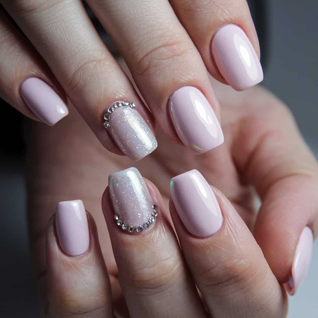 Close-up of Light Pink Nude Nail art featuring delicate rhinestones for a touch of glamour