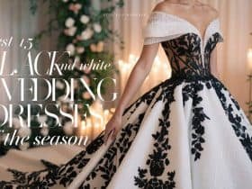 Elegant bride in a black and white wedding dress, showcasing a luxurious lace design and dramatic contrast against a romantic garden backdrop.