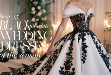 Elegant bride in a black and white wedding dress, showcasing a luxurious lace design and dramatic contrast against a romantic garden backdrop.