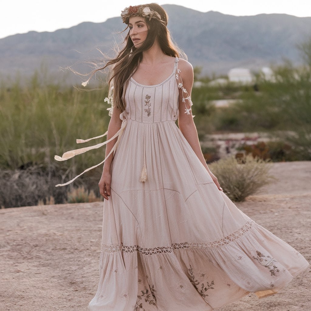 Effortlessly chic Western Boho maxi dress with flowing cotton fabric and natural embroidery, ideal for a laid-back outdoor wedding celebration.