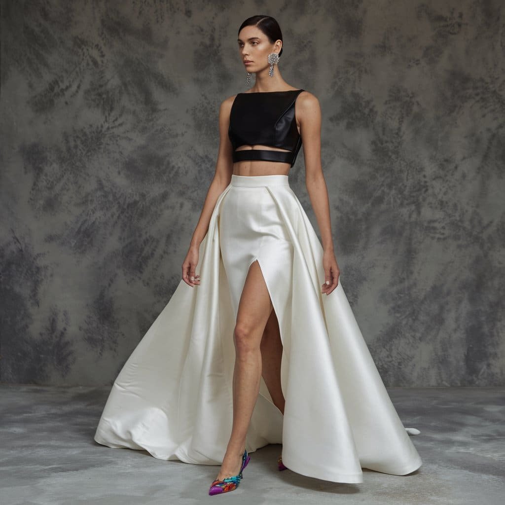 Bold black and white wedding dresses featuring a two-piece ensemble with a contrast black top and white skirt.
