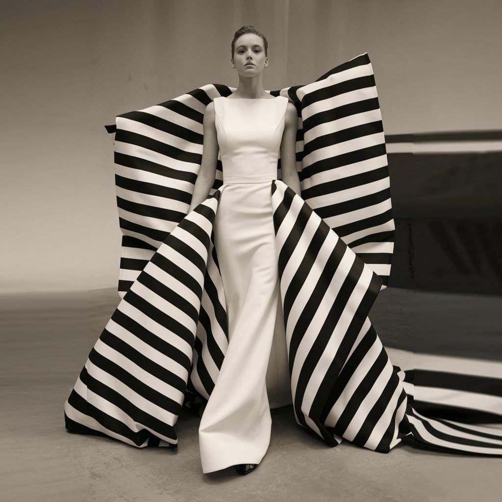 Bride wearing a graphic monochrome striped black and white wedding dress, perfect for a fashion-forward bride.