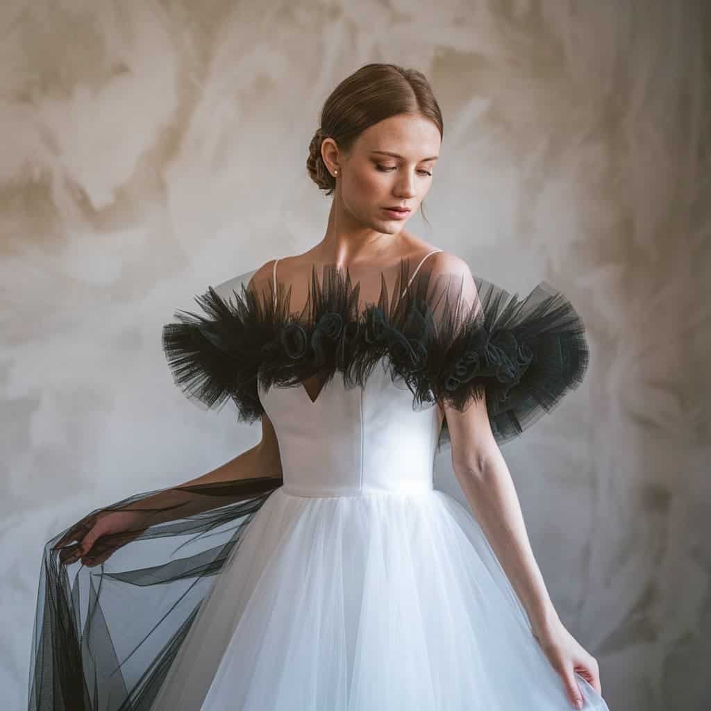 Ethereal black and white wedding dress with black tulle overlay adding texture and depth to the A-line silhouette.