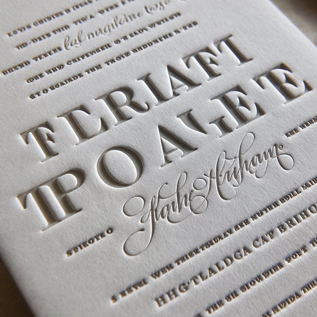 Elegant black and white wedding invitation with raised letterpress printing for a classic, handcrafted touch.