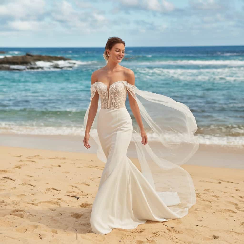 Beautiful off-the-shoulder gown with a dramatic train and structured silhouette, ideal for a glamorous wedding celebration.