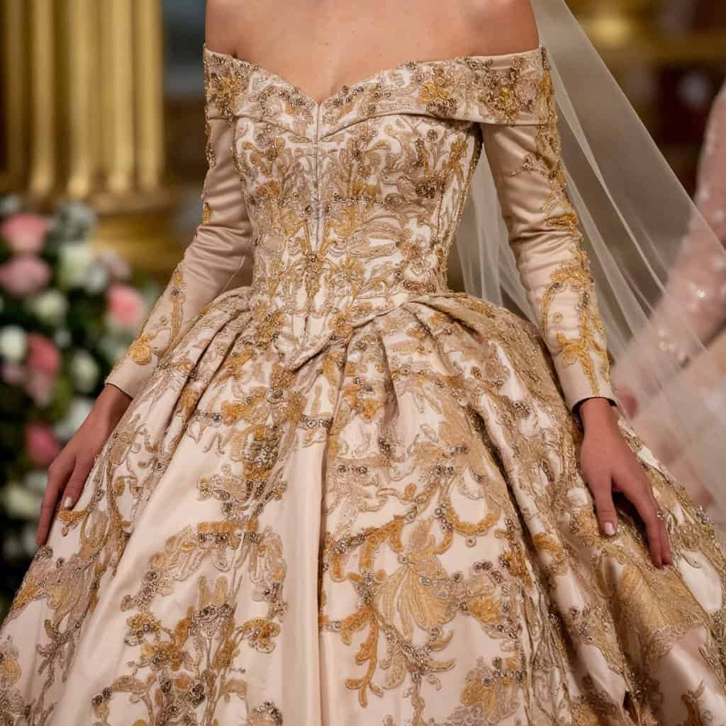 Sophisticated royal wedding dress with exquisite embroidery and an off-the-shoulder neckline, ideal for a grand celebration.