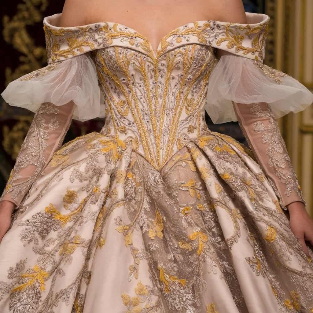 Elegant royal off-the-shoulder wedding dress featuring opulent embroidery, perfect for a luxurious bridal experience