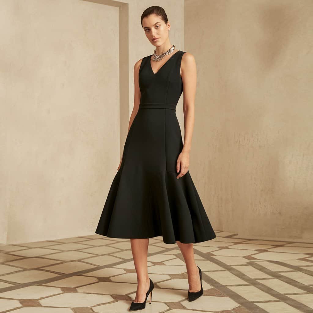 Black Wedding Guest Dresses: Sleek Sheath Dress with Side Slit for Added Glamour – A sleek black sheath dress with a side slit, adding a touch of glamour to your wedding guest appearance.
