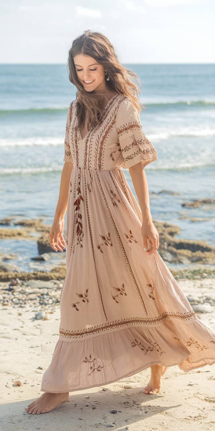 Free-spirited beach wedding guest dresses in boho chic style with embroidery.