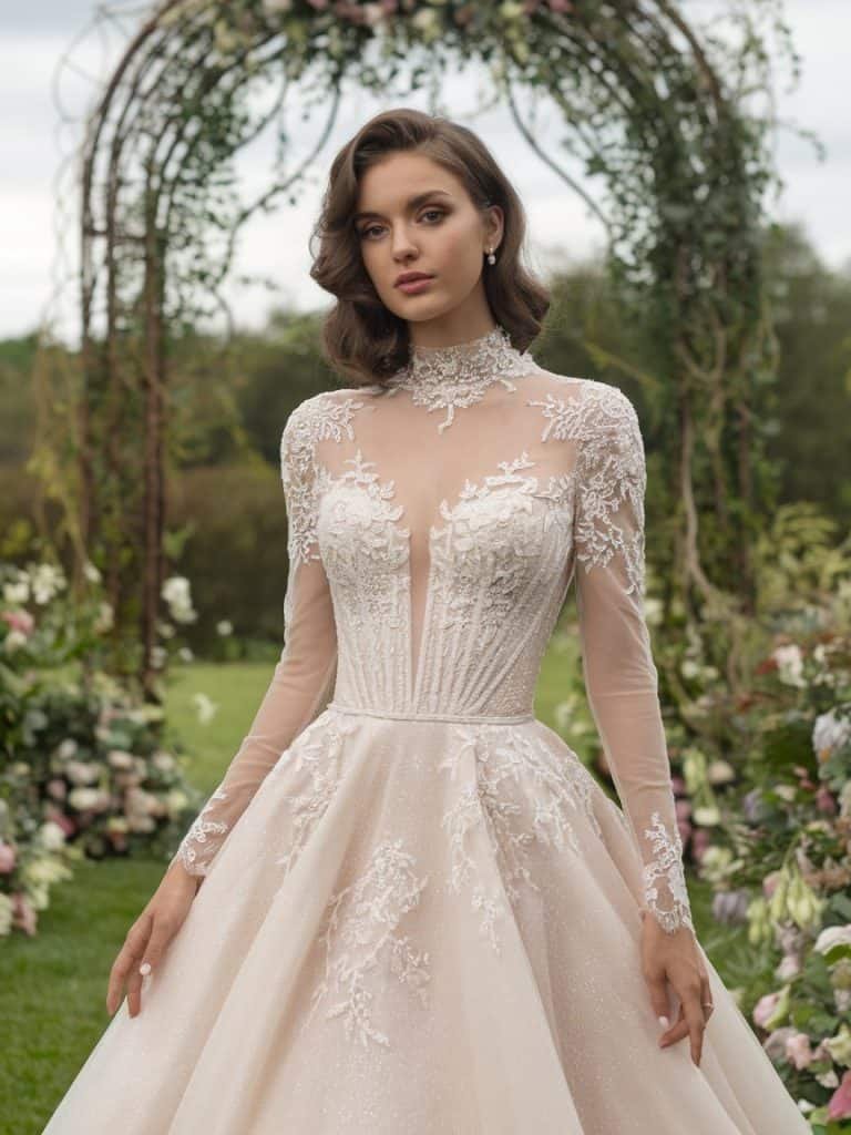 High-neck wedding dress with dramatic full sleeves, lace, and sheer details, adding vintage charm to your bridal style