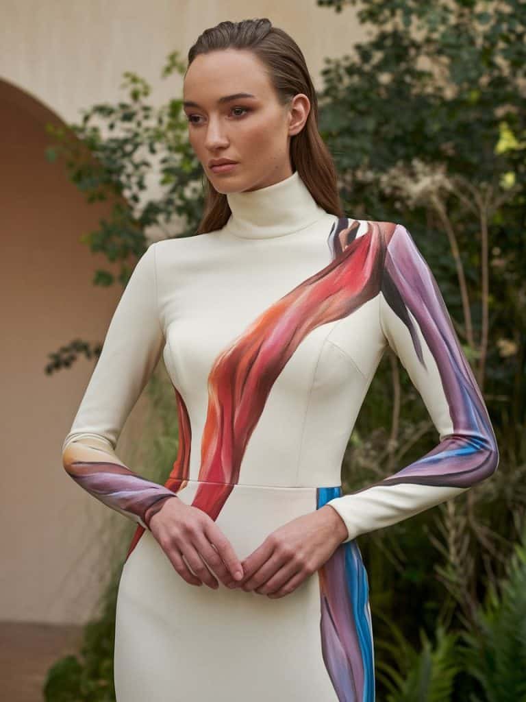 Custom high-neck wedding dress featuring hand-painted floral designs, offering an artistic, one-of-a-kind bridal style