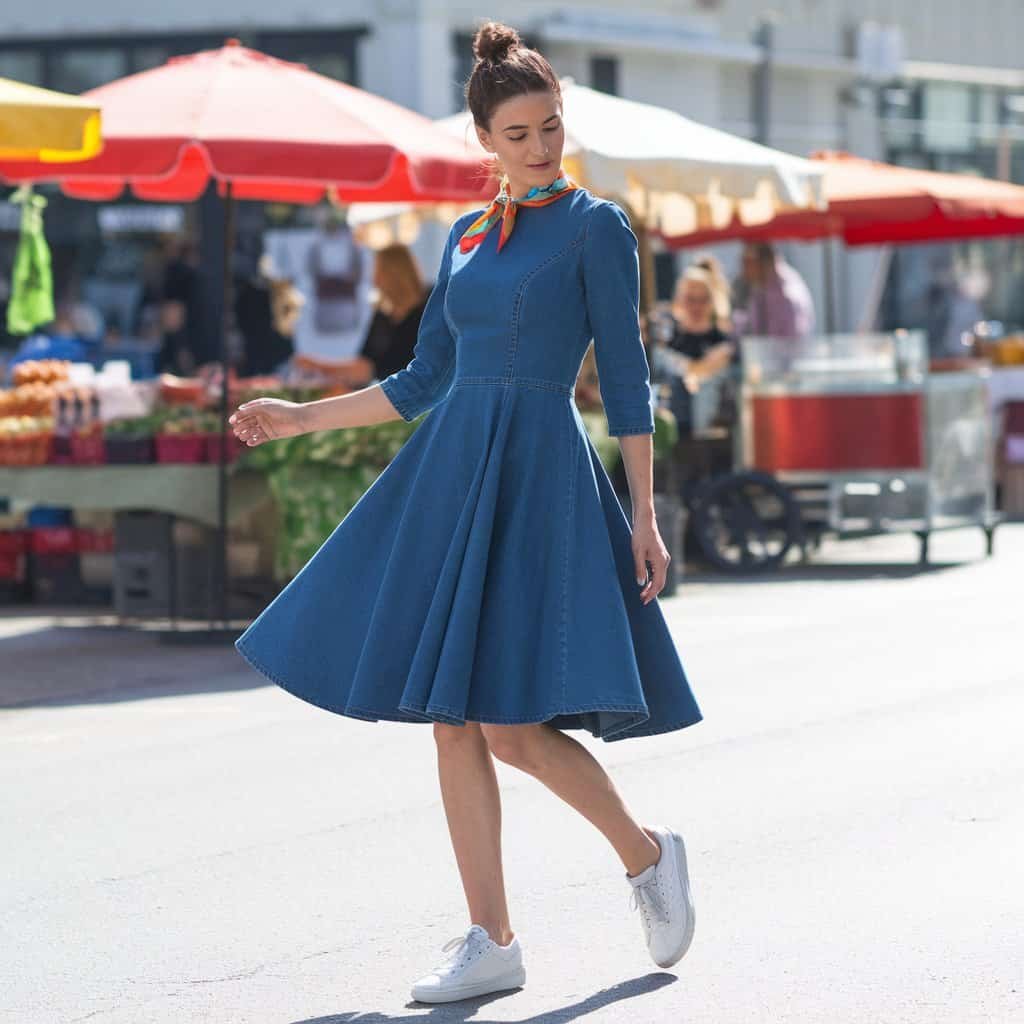 Casual and stylish Denim Fit and Flare Dress paired with a bright scarf, perfect for a fun pop of color