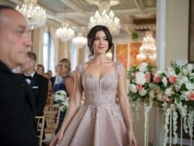 Close-up of a stylish woman wearing a chic cocktail dress in front of a large ‘15’ graphic, set against an elegant wedding ceremony backdrop, highlighting the ‘15 Latest Cocktail Dresses for Weddings in 2025.’