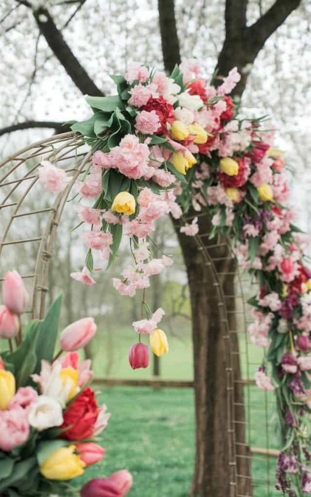 Sophisticated monochromatic Wedding Arch Flowers in soft white and ivory hues, creating a classy and cohesive design.
