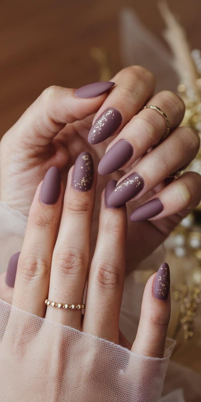 Chic dusty mauve bridal nails complementing gowns with pink or purple undertones, enhancing overall wedding harmony