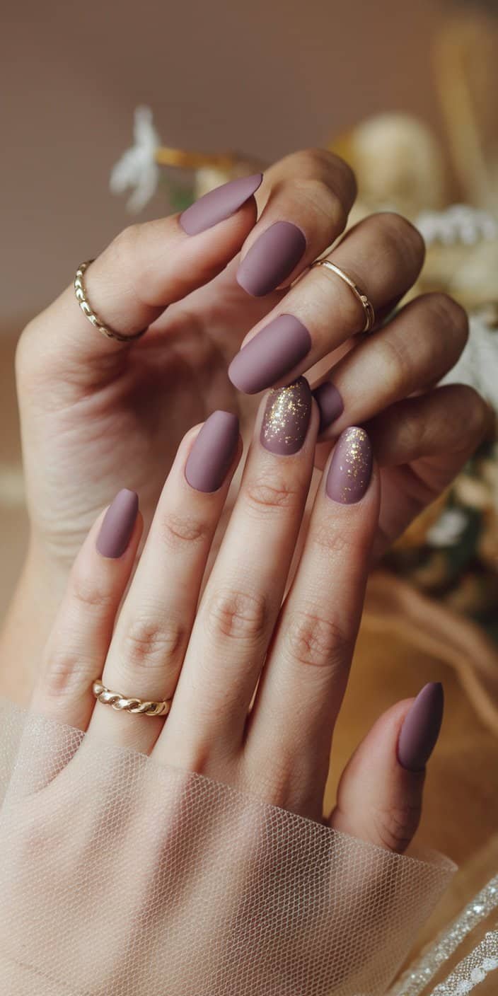 Elegant dusty mauve manicure with a matte finish, perfect for brides seeking a rich yet subtle nail color