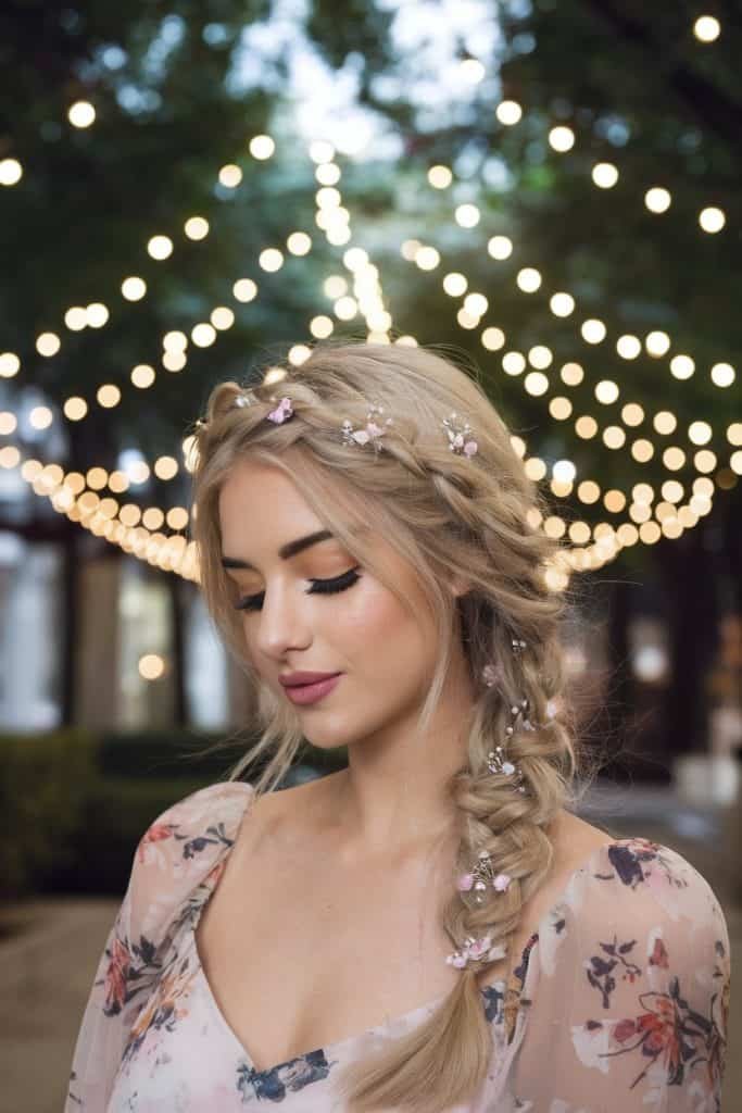 Romantic braided hairstyle and subtle makeup paired with a Valentine's Day dress for a soft, feminine look