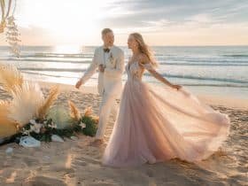 Diverse range of beach wedding dress styles captured on a sandy backdrop, highlighting the perfect blend of elegance and ease for a Summer 2025 coastal ceremony.
