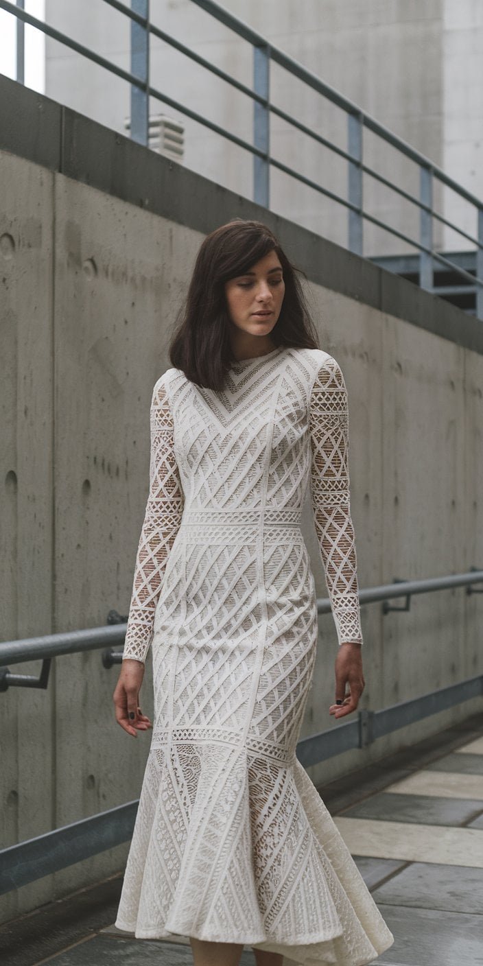 Exquisite trumpet wedding dress with delicate embroidery accentuating its tailored design and gentle flare, a top choice in trumpet wedding dresses.